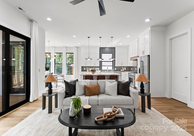 1626 Burtonwood Cir, Charlotte, NC 28212 - living area with light wood-style flooring, ceiling fan, and recessed lighting