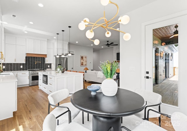 1626 Burtonwood Cir, Charlotte, NC 28212 - dining room with light wood-style flooring, recessed lighting, and a chandelier