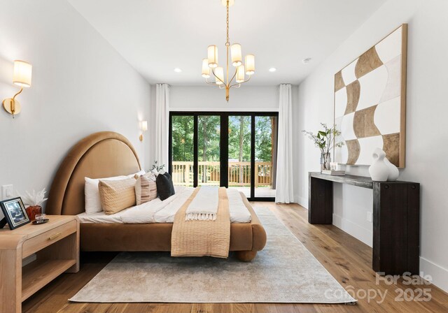 1626 Burtonwood Cir, Charlotte, NC 28212 - bedroom featuring access to exterior, a chandelier, recessed lighting, and wood finished floors