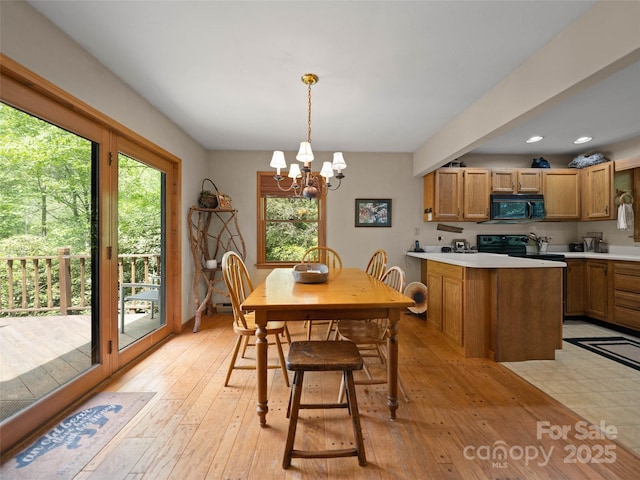 1396 W Christy Trl, Sapphire, NC 28774 - dining room featuring plenty of natural light, a chandelier, light wood finished floors, and recessed lighting
