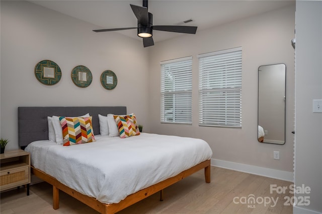 2011 Hamorton Pl, Charlotte, NC 28205 - bedroom with light wood-type flooring, baseboards, and a ceiling fan