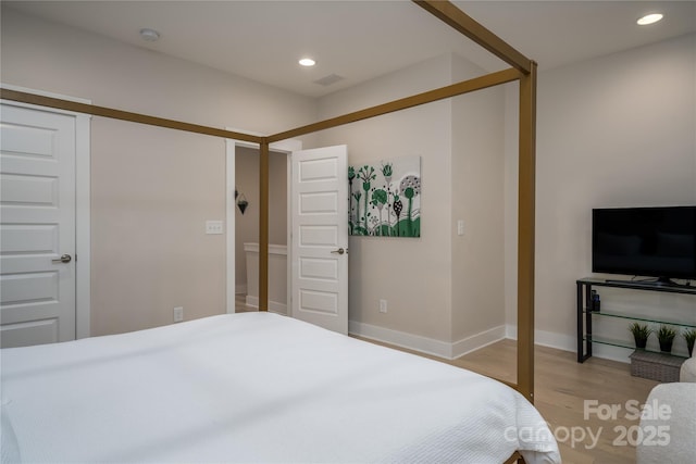 2011 Hamorton Pl, Charlotte, NC 28205 - bedroom with light wood-type flooring, recessed lighting, and baseboards