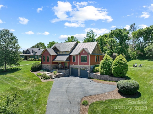 15 Carl Roberts Rd, Alexander, NC 28701 - view of front of house with stone siding, driveway, a front yard, and a garage