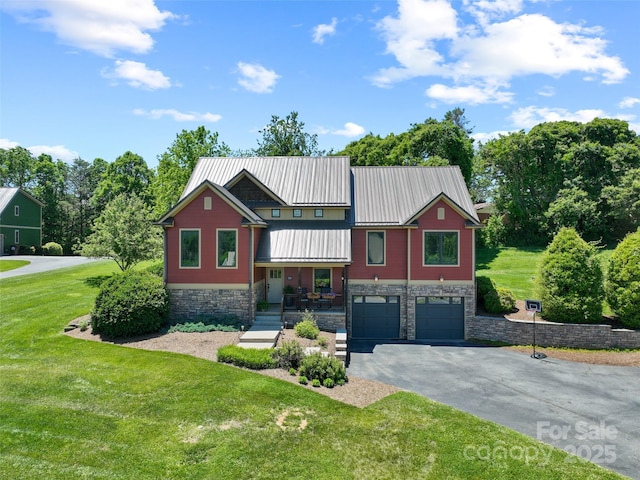 15 Carl Roberts Rd, Alexander, NC 28701 - view of front facade with stone siding, driveway, an attached garage, and a front lawn