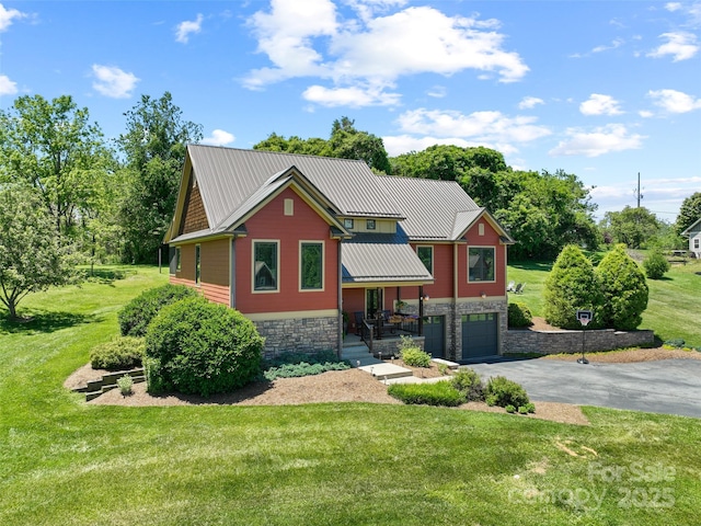 15 Carl Roberts Rd, Alexander, NC 28701 - view of front of home with stone siding, asphalt driveway, a front lawn, and a garage
