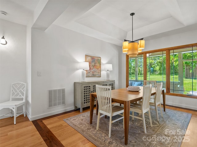 15 Carl Roberts Rd, Alexander, NC 28701 - dining area featuring a tray ceiling, wood finished floors, a chandelier, and baseboards