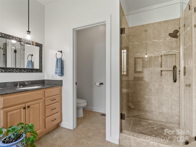 15 Carl Roberts Rd, Alexander, NC 28701 - bathroom featuring a shower stall, vanity, toilet, and tile patterned flooring