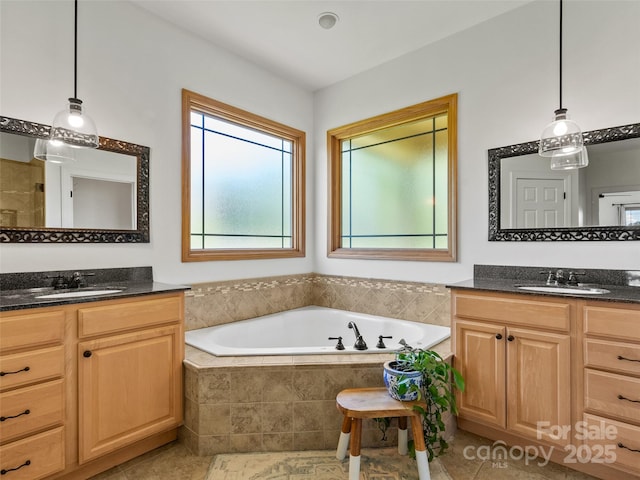15 Carl Roberts Rd, Alexander, NC 28701 - full bathroom with a garden tub, two vanities, and tile patterned flooring