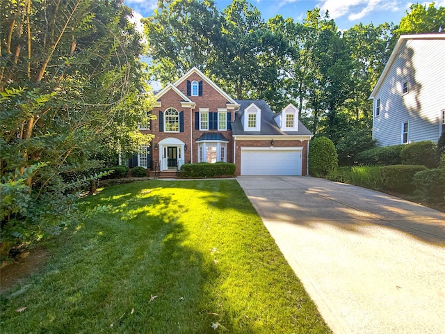 8803 Sweetwater Pl, Waxhaw, NC 28173 - view of front of property with brick siding, concrete driveway, a front yard, and a garage