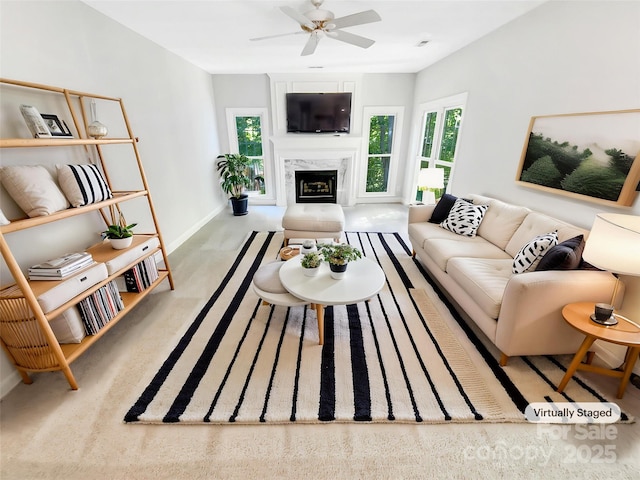 8803 Sweetwater Pl, Waxhaw, NC 28173 - living area featuring plenty of natural light, baseboards, a ceiling fan, and a premium fireplace