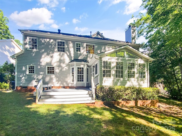 8803 Sweetwater Pl, Waxhaw, NC 28173 - back of house featuring a chimney, a yard, and a deck