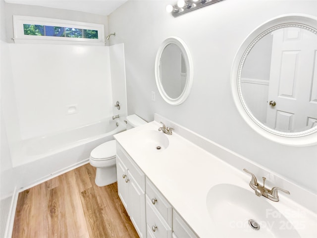 8803 Sweetwater Pl, Waxhaw, NC 28173 - bathroom featuring wood finished floors, toilet, double vanity, and bathing tub / shower combination