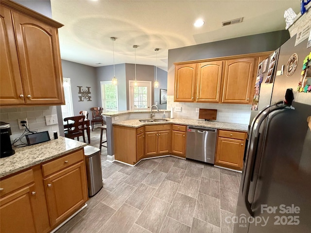 3110 Richards Way Dr, Rock Hill, SC 29732 - kitchen featuring dishwasher, a sink, a peninsula, decorative backsplash, and light stone countertops