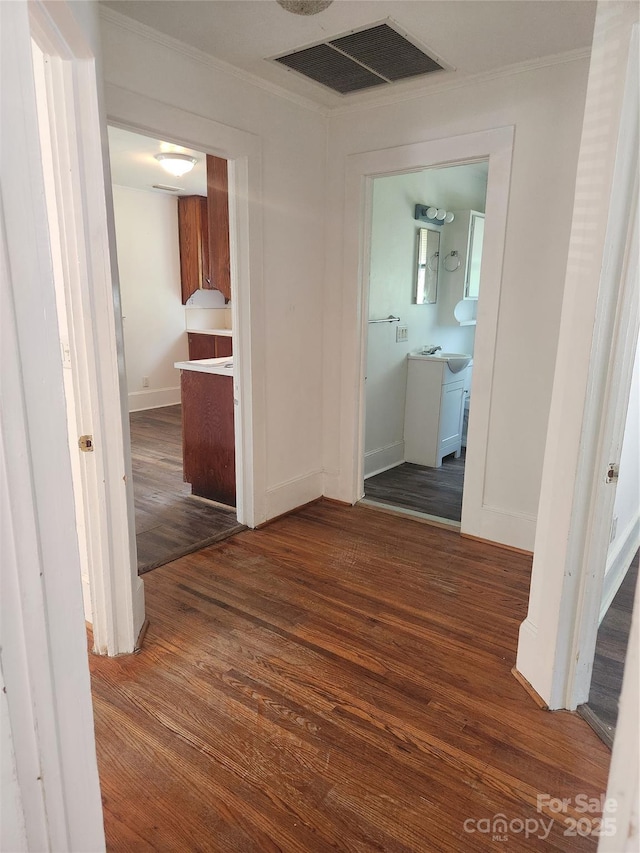 76 Sumner Ave NW, Concord, NC 28027 - hallway featuring wood finished floors, ornamental molding, and baseboards