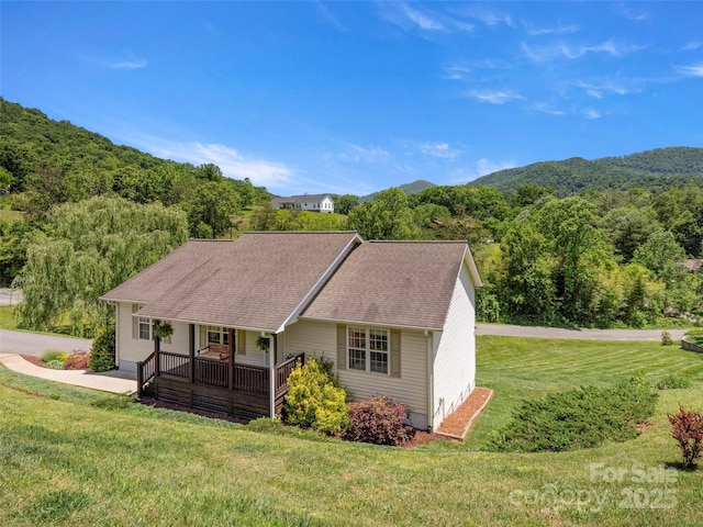 8 Rose Briar Cir, Weaverville, NC 28787 - view of front of property featuring a front lawn, covered porch, a forest view, roof with shingles, and a mountain view