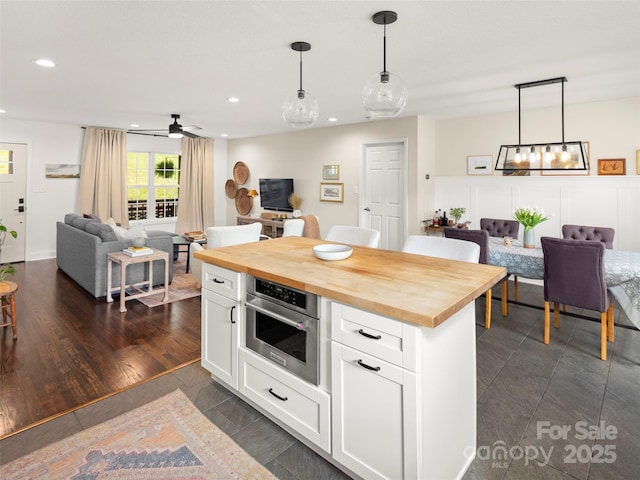 8 Rose Briar Cir, Weaverville, NC 28787 - kitchen with butcher block counters, recessed lighting, open floor plan, white cabinetry, and stainless steel oven