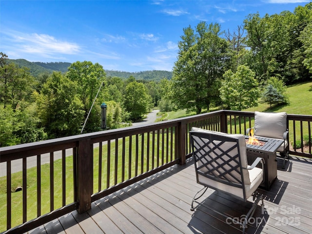 8 Rose Briar Cir, Weaverville, NC 28787 - wooden deck featuring a fire pit, a lawn, and a view of trees