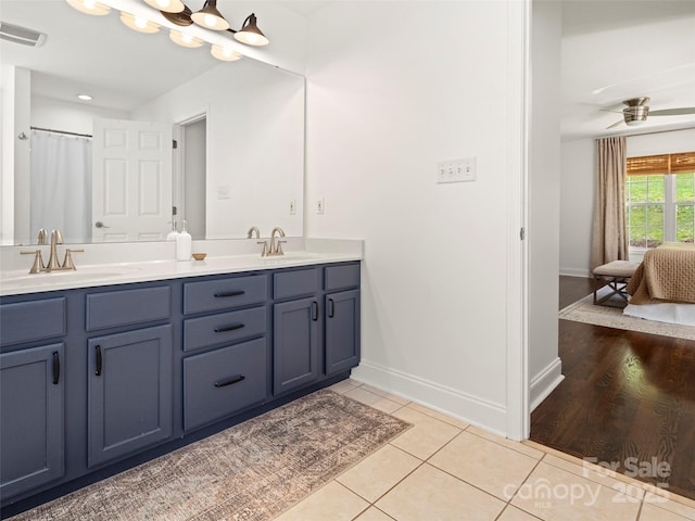 8 Rose Briar Cir, Weaverville, NC 28787 - full bathroom with double vanity, baseboards, tile patterned floors, and a ceiling fan