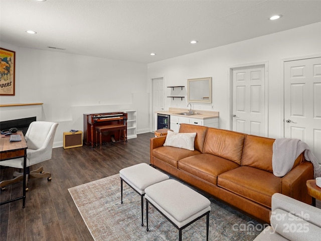 8 Rose Briar Cir, Weaverville, NC 28787 - living room with wine cooler, dark wood-style flooring, recessed lighting, baseboards, and a fireplace