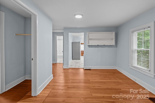 310 S Spencer Ave, Spencer, NC 28159 - unfurnished bedroom with light wood-style floors and a closet