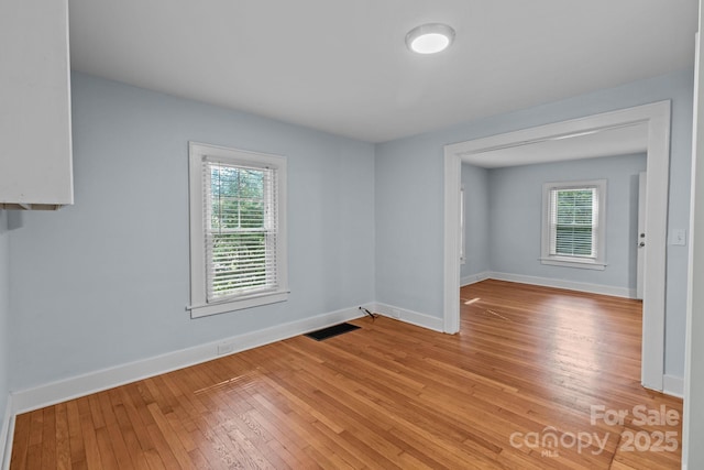 310 S Spencer Ave, Spencer, NC 28159 - unfurnished room featuring healthy amount of natural light and light wood-style flooring