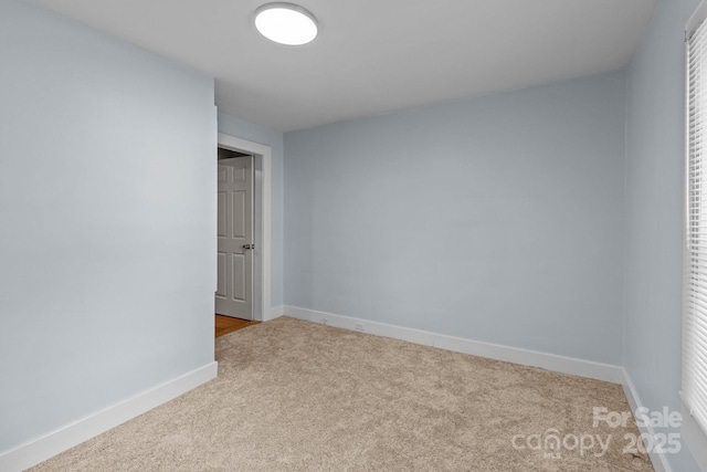 310 S Spencer Ave, Spencer, NC 28159 - unfurnished bedroom with carpet flooring and baseboards