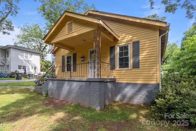 310 S Spencer Ave, Spencer, NC 28159 - view of front of home with covered porch and a front lawn
