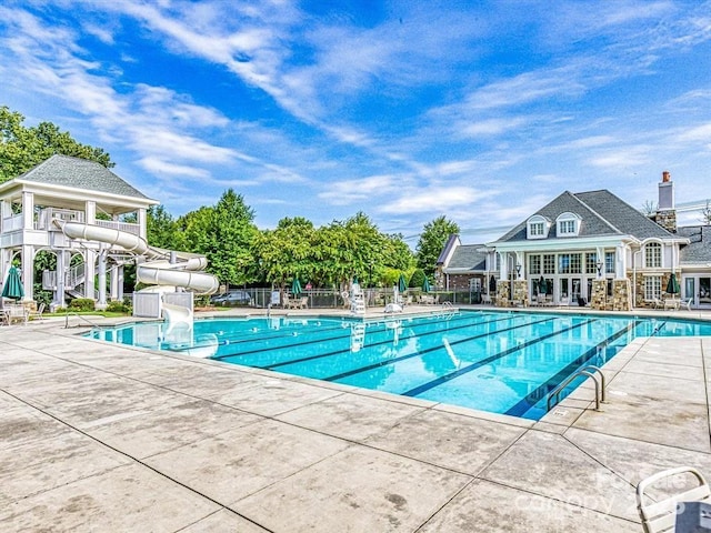 8725 Soaring Eagle Ln, Waxhaw, NC 28173 - community pool with a water slide and a patio area