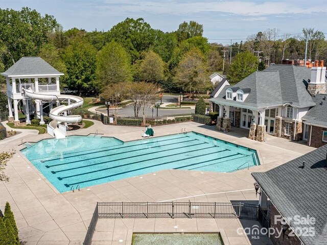 8725 Soaring Eagle Ln, Waxhaw, NC 28173 - community pool with a water slide and a patio