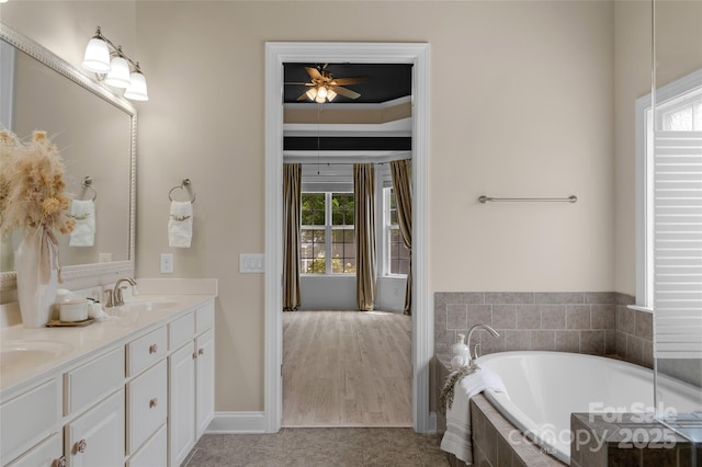 8725 Soaring Eagle Ln, Waxhaw, NC 28173 - full bathroom featuring double vanity, a garden tub, and a ceiling fan