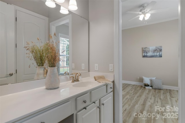 8725 Soaring Eagle Ln, Waxhaw, NC 28173 - bathroom with vanity, wood finished floors, crown molding, and a ceiling fan