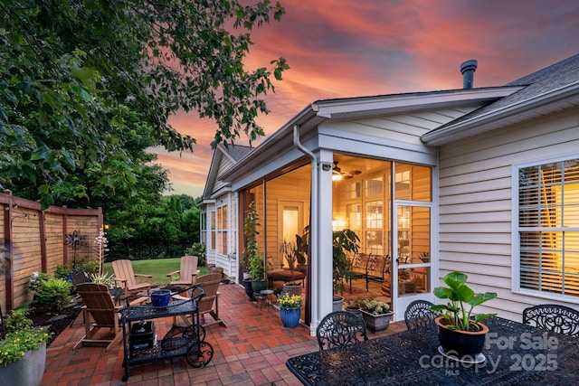 8725 Soaring Eagle Ln, Waxhaw, NC 28173 - patio terrace at dusk with a patio, outdoor dining space, and an outdoor fire pit