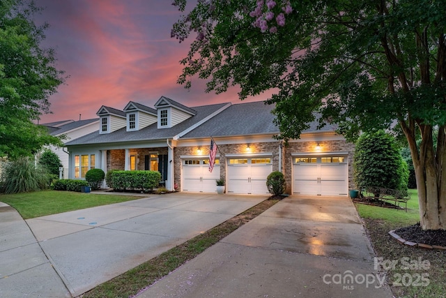 8725 Soaring Eagle Ln, Waxhaw, NC 28173 - view of front of home with brick siding, concrete driveway, a front yard, a garage, and a shingled roof
