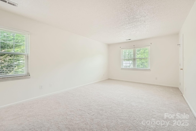 6221 Round Hill Rd, Charlotte, NC 28211 - unfurnished room with a textured ceiling and light colored carpet