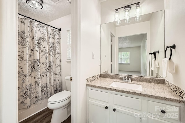 6221 Round Hill Rd, Charlotte, NC 28211 - full bathroom with a textured ceiling, vanity, and wood finished floors