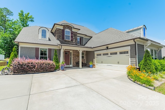 1812 Sutter Creek Dr, Waxhaw, NC 28173 - view of front facade with an attached garage, concrete driveway, roof with shingles, and stone siding