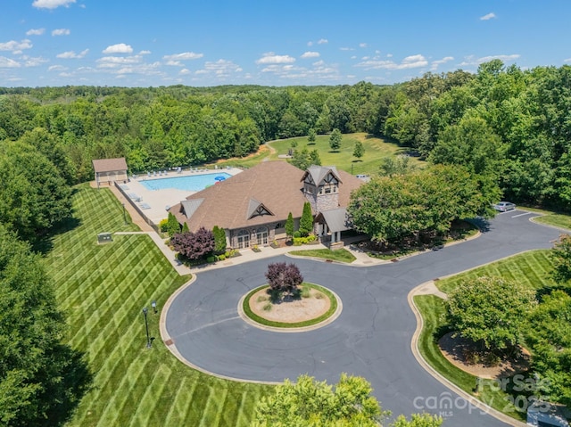 1812 Sutter Creek Dr, Waxhaw, NC 28173 - view of subject property with a pool and a forest