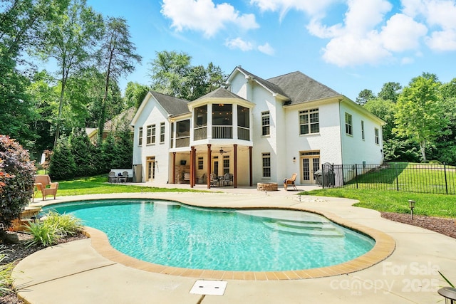 167 Logan Crossing Dr, Davidson, NC 28036 - back of property featuring a sunroom, a patio, french doors, an outdoor fire pit, and ceiling fan