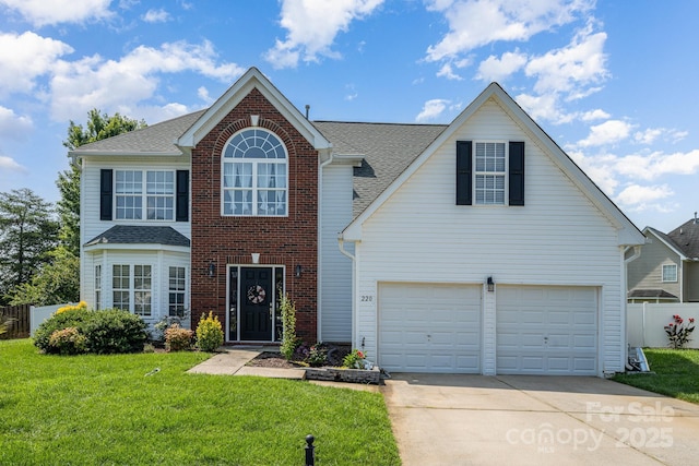 220 Otman Ct, Rock Hill, SC 29732 - traditional-style house with concrete driveway, roof with shingles, a garage, and brick siding