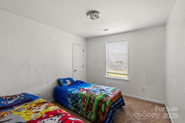 9612 Old Dowd Rd, Charlotte, NC 28214 - carpeted bedroom with baseboards
