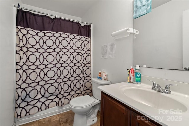 9612 Old Dowd Rd, Charlotte, NC 28214 - bathroom featuring vanity, toilet, and tile patterned flooring