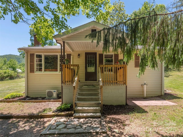 292 Cook Rd, Canton, NC 28716 - bungalow-style home with a porch, a chimney, and a cooling unit