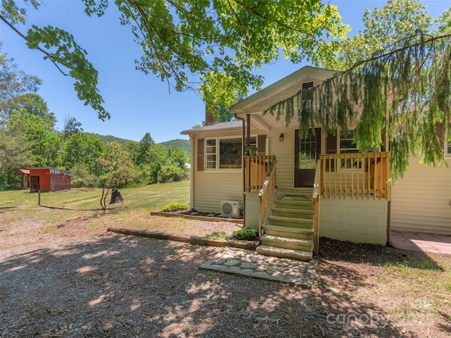 292 Cook Rd, Canton, NC 28716 - back of house with covered porch, a cooling unit, and a chimney