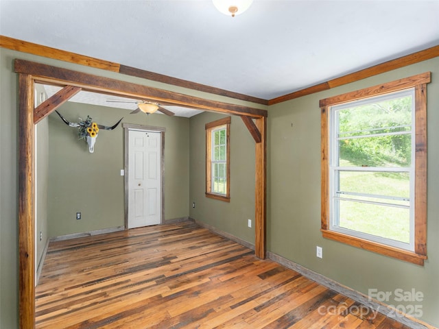 292 Cook Rd, Canton, NC 28716 - empty room with plenty of natural light, wood finished floors, baseboards, and a ceiling fan