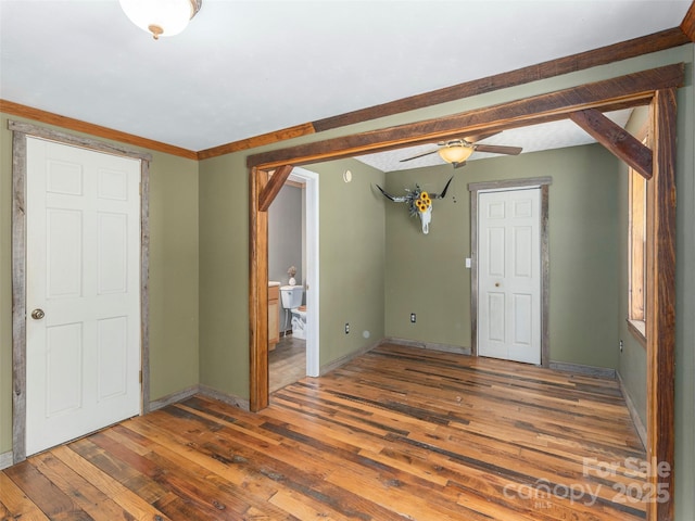 292 Cook Rd, Canton, NC 28716 - unfurnished living room featuring wood-type flooring, baseboards, and a ceiling fan