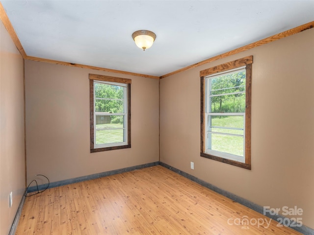 292 Cook Rd, Canton, NC 28716 - unfurnished room with light wood-style floors, baseboards, and crown molding