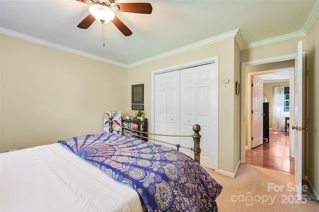 98 Driftwood Ln Unit 7, Mills River, NC 28759 - bedroom with ornamental molding, light colored carpet, a closet, baseboards, and a ceiling fan