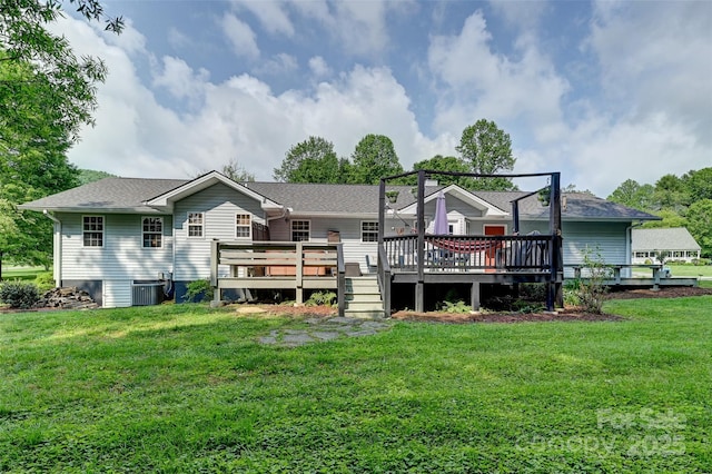 98 Driftwood Ln Unit 7, Mills River, NC 28759 - back of house with a wooden deck, a lawn, and a shingled roof
