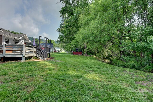98 Driftwood Ln Unit 7, Mills River, NC 28759 - view of green lawn with a wooden deck