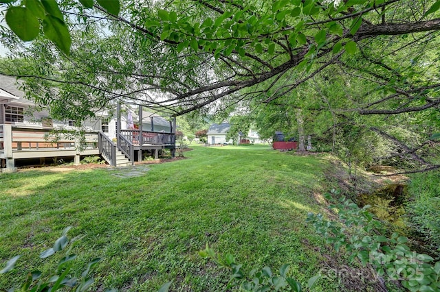 98 Driftwood Ln Unit 7, Mills River, NC 28759 - view of grassy yard with a wooden deck
